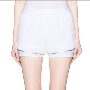 ALALA white running short. Size M. Silver piping